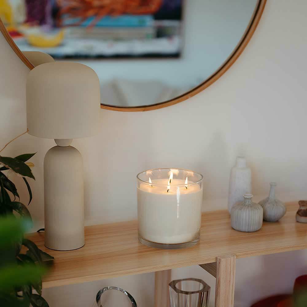 CandleXchange 1.5kg candle sitting on side table