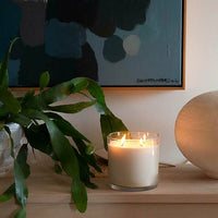 CandleXchange 1.5kg candle lit on side table